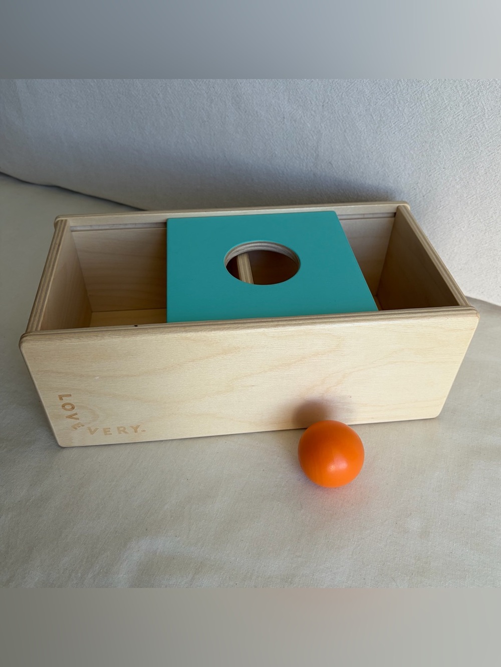 Lovevery Sliding Top Box Toy from the Thinker Playkit with Orange Wooden Ball